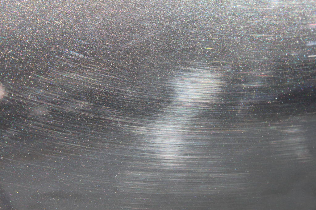 BMW Sapphire Black Metallic paint with lots of swirls from being washed improperly