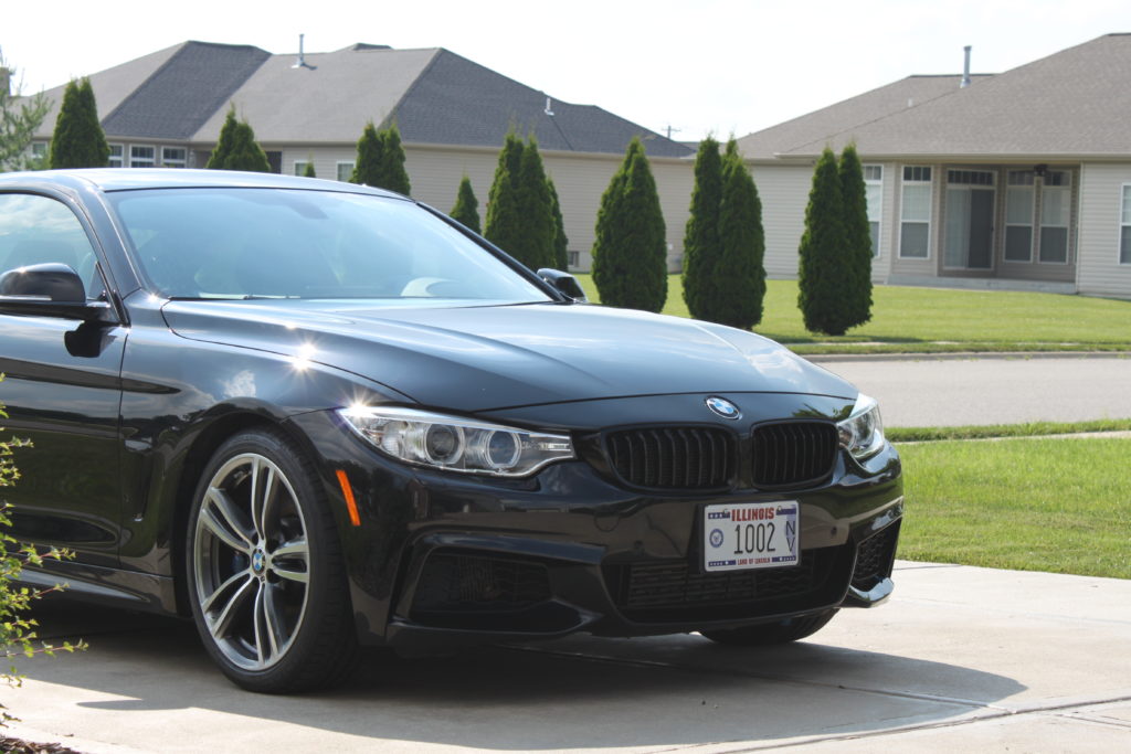 Front of the black BMW 435i after polishing and coating.