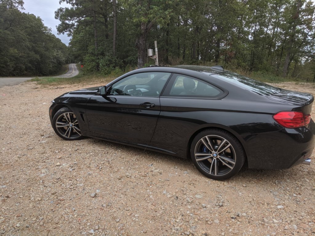 Black BMW 435i on a country road