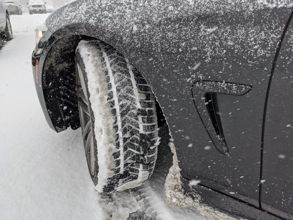 Close up of Pirelli Sottozero 3 winter tires in snow.